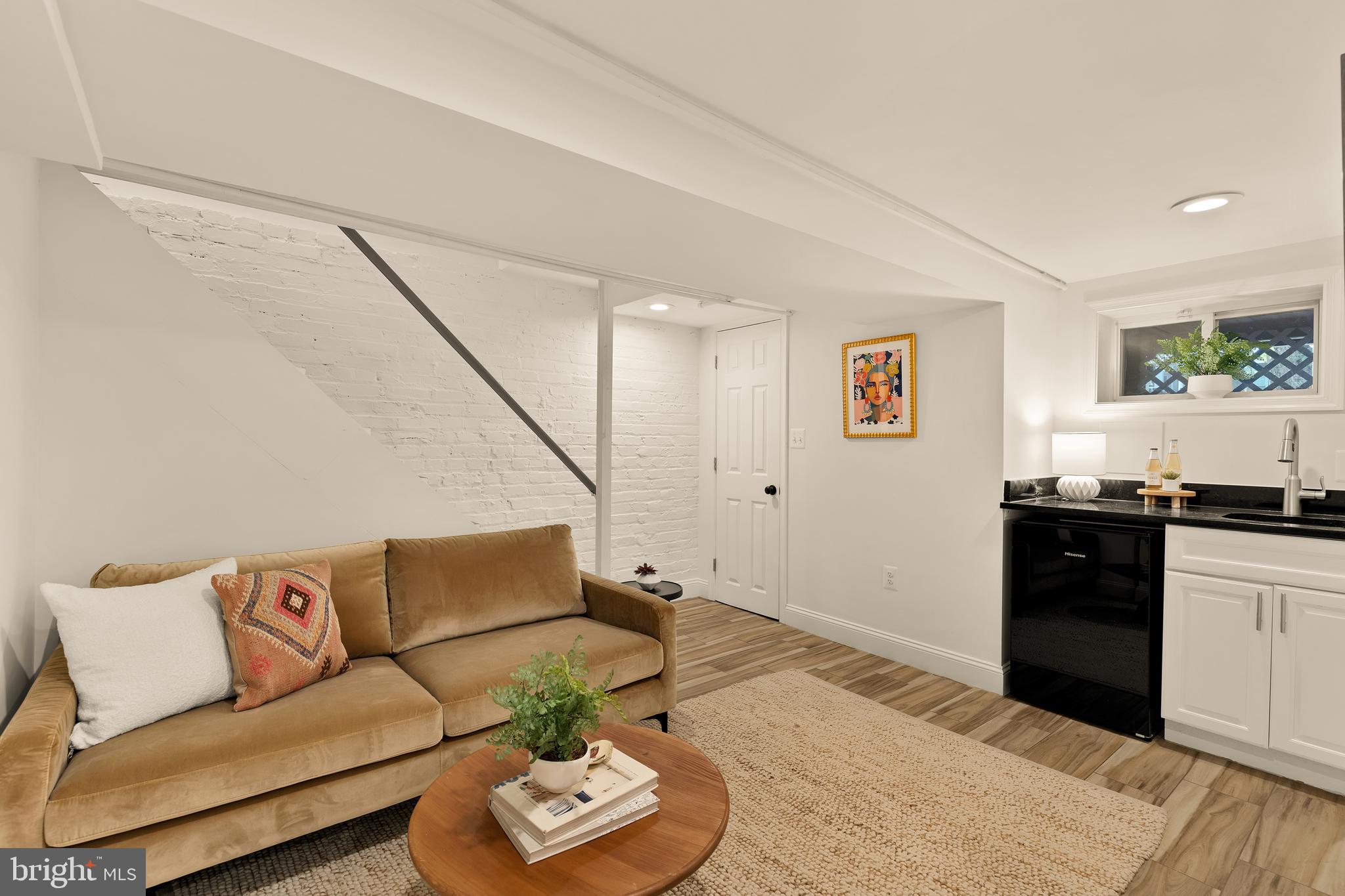 222 Tennessee Avenue Northeast Washington, DC 20002 - Photo 19 of 29 a living room with furniture and kitchen view