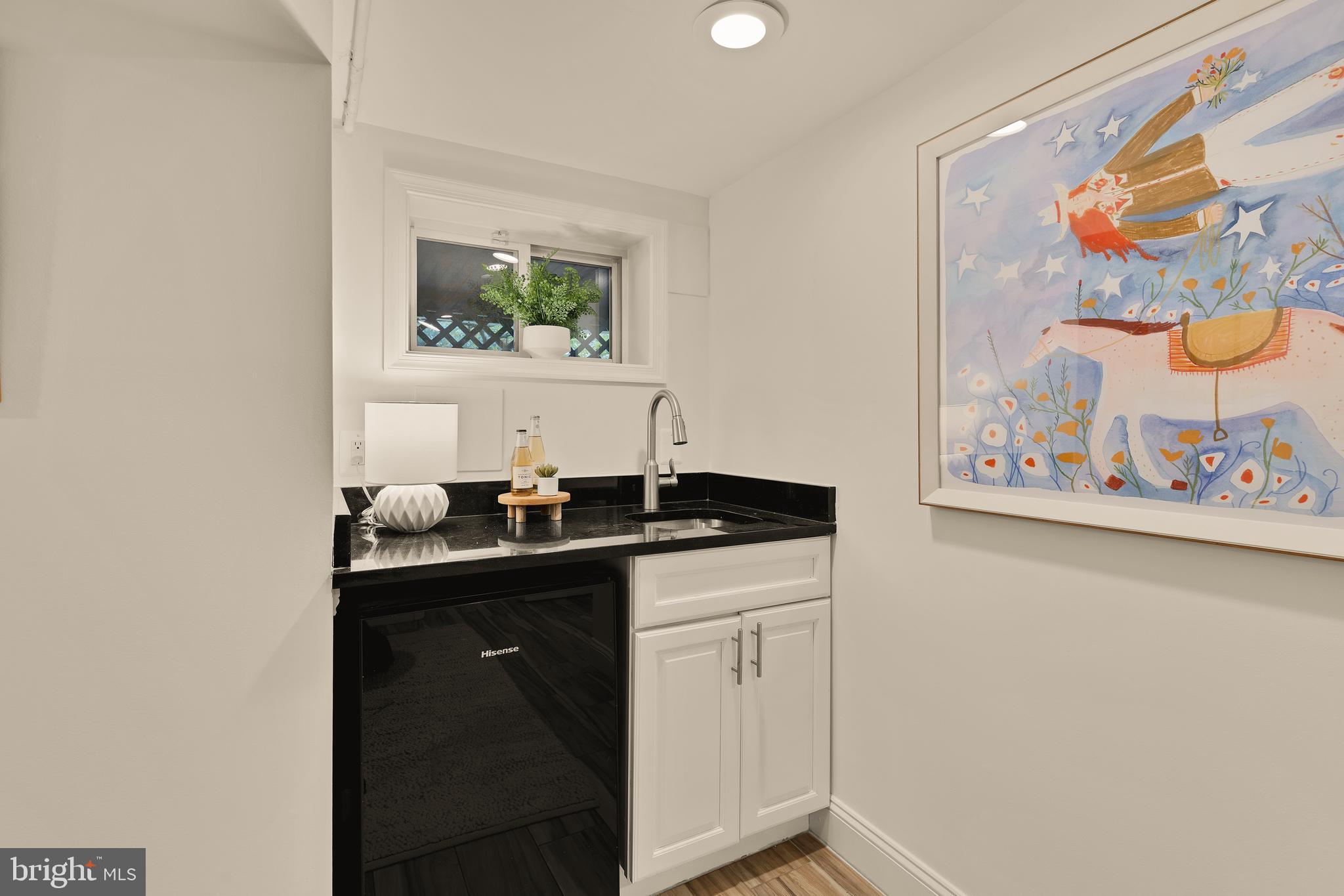 222 Tennessee Avenue Northeast Washington, DC 20002 - Photo 20 of 29 a bathroom with a sink and a mirror