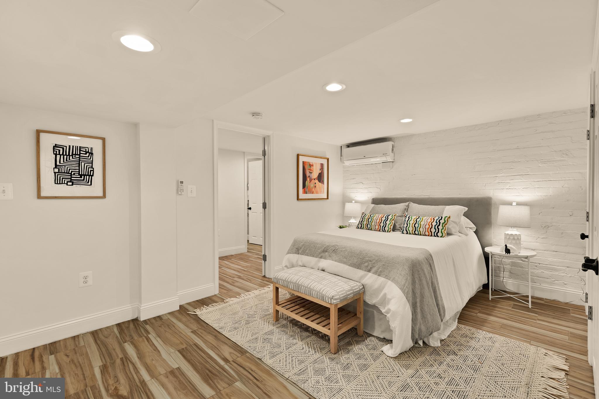 222 Tennessee Avenue Northeast Washington, DC 20002 - Photo 23 of 29 a bedroom with a bed and a lamp on table