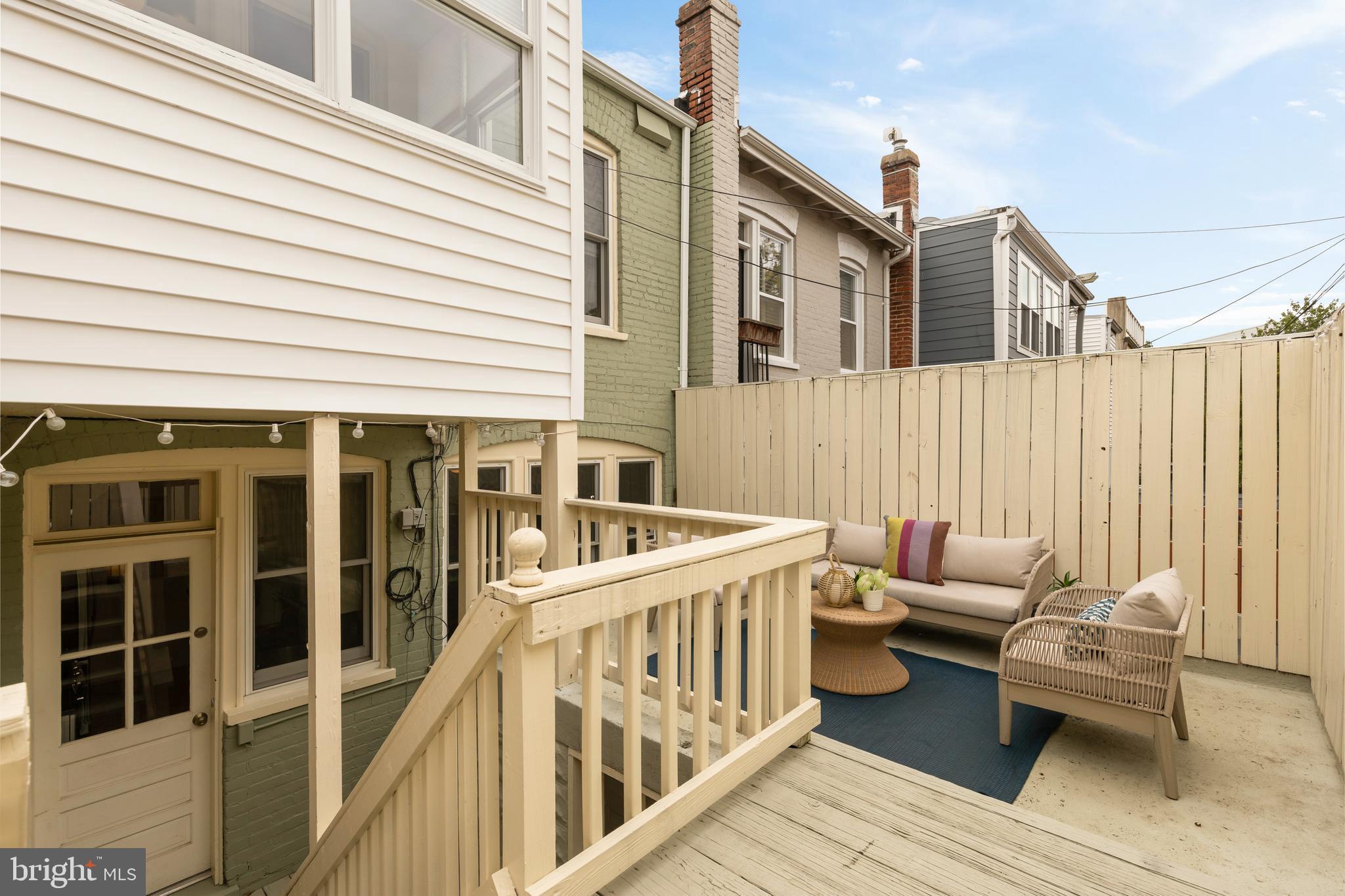 222 Tennessee Avenue Northeast Washington, DC 20002 - Photo 25 of 29 a balcony with furniture and wooden floor
