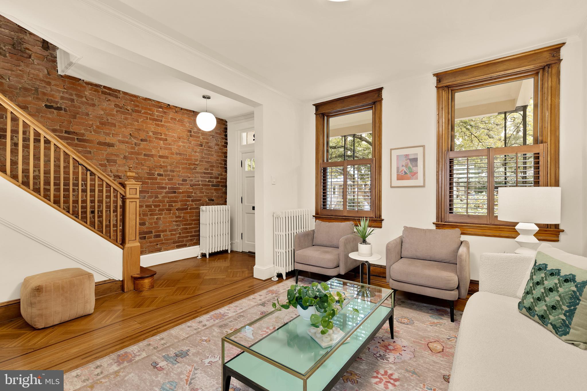 222 Tennessee Avenue Northeast Washington, DC 20002 - Photo 5 of 29 a living room with furniture and a potted plant