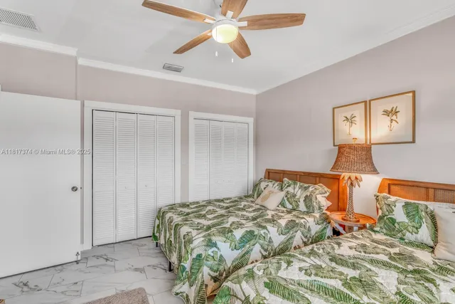 a living room with couch and a large window
