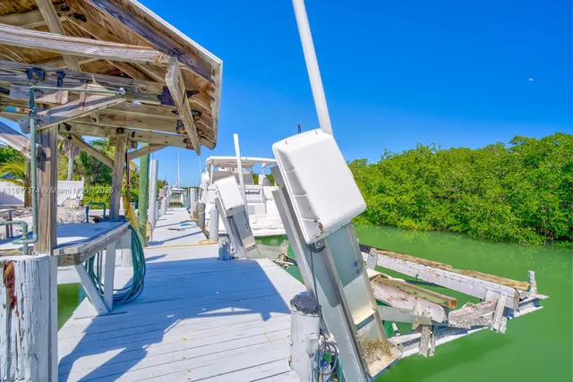 a view of a balcony with furniture and garden view