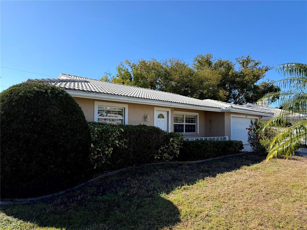 a front view of a house with garden