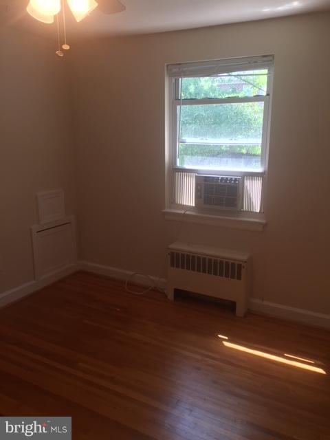 2808 16th Road South, Unit 2808B Arlington, VA 22204 - Photo 11 of 15 an empty room with wooden floor and windows