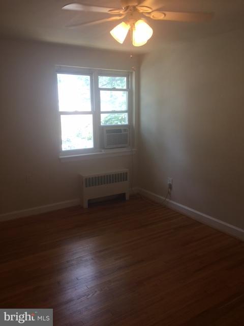 2808 16th Road South, Unit 2808B Arlington, VA 22204 - Photo 12 of 15 an empty room with wooden floor and windows