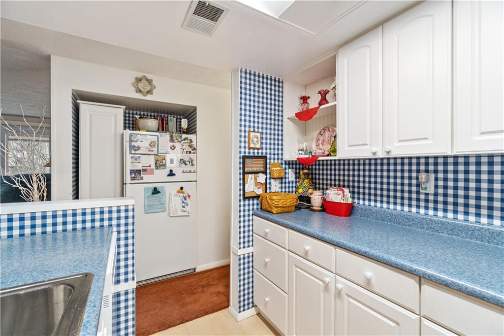 321 Ridge Point Circle, Unit 33B Bridgeville, PA 15017 - Photo 19 of 25 a kitchen with a sink cabinets and window