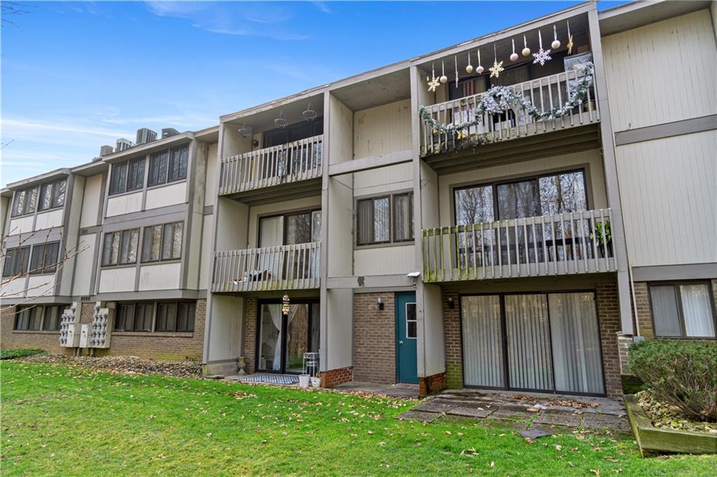 321 Ridge Point Circle, Unit 33B Bridgeville, PA 15017 - Photo 25 of 25 a view of a building with a yard