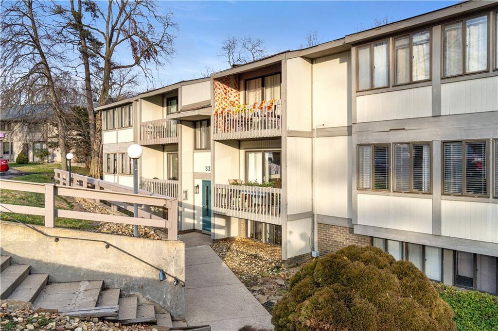 321 Ridge Point Circle, Unit 33B Bridgeville, PA 15017 - Photo 3 of 25 a front view of a building with a garden