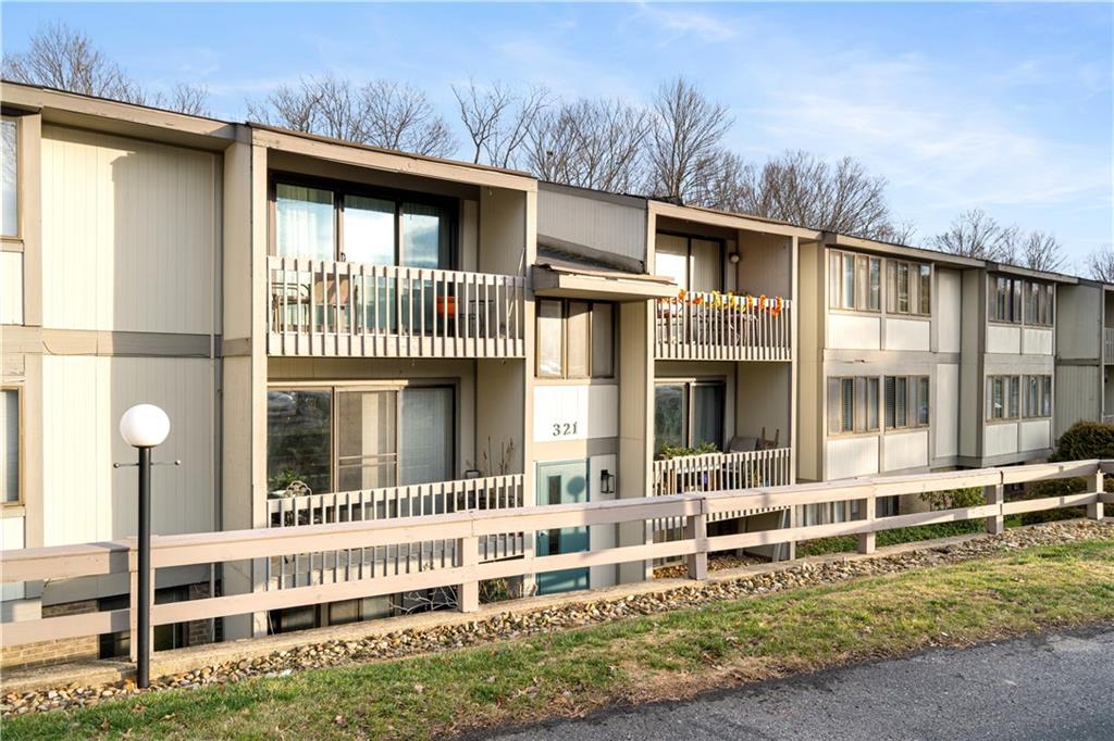 321 Ridge Point Circle, Unit 33B Bridgeville, PA 15017 - Photo 4 of 25 a front view of a house with a yard