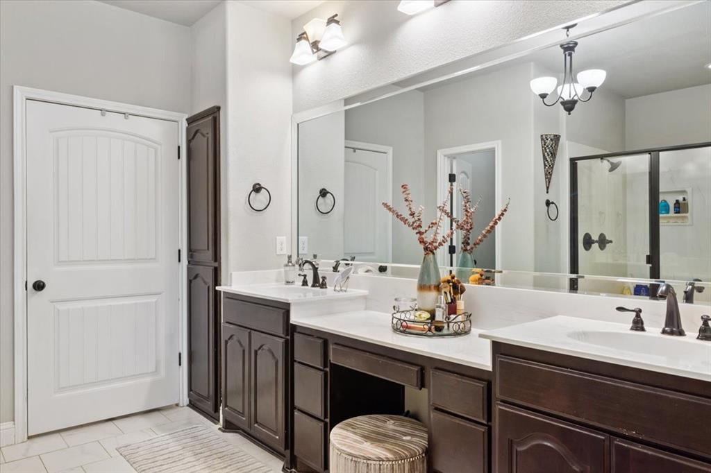 2170 Derrs Chapel Road Italy, TX 76651 - Photo 16 of 38 a bathroom with a sink double vanity granite and a mirror