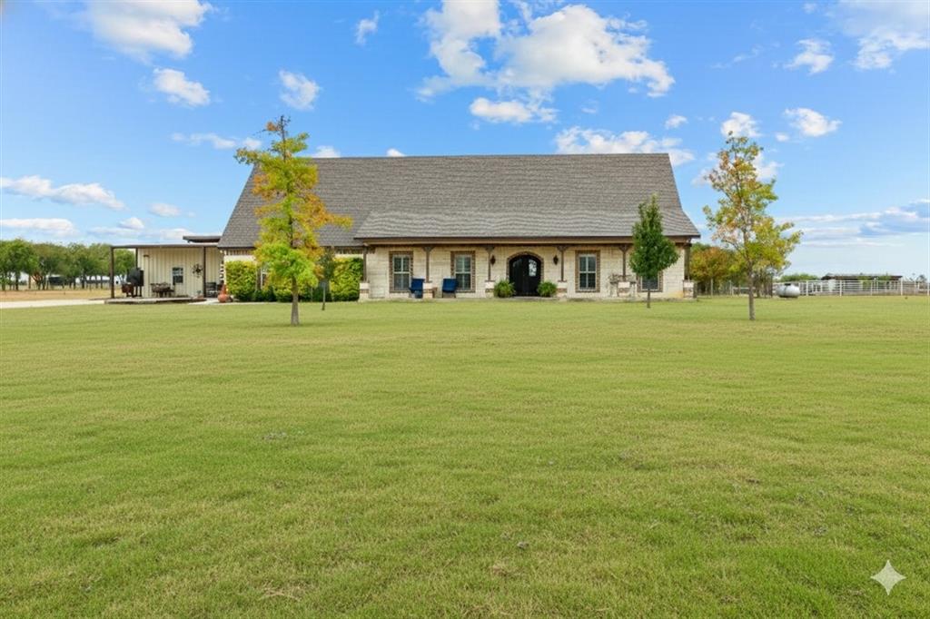 2170 Derrs Chapel Road Italy, TX 76651 - Photo 2 of 38 a front view of house with an ocean and a big yard