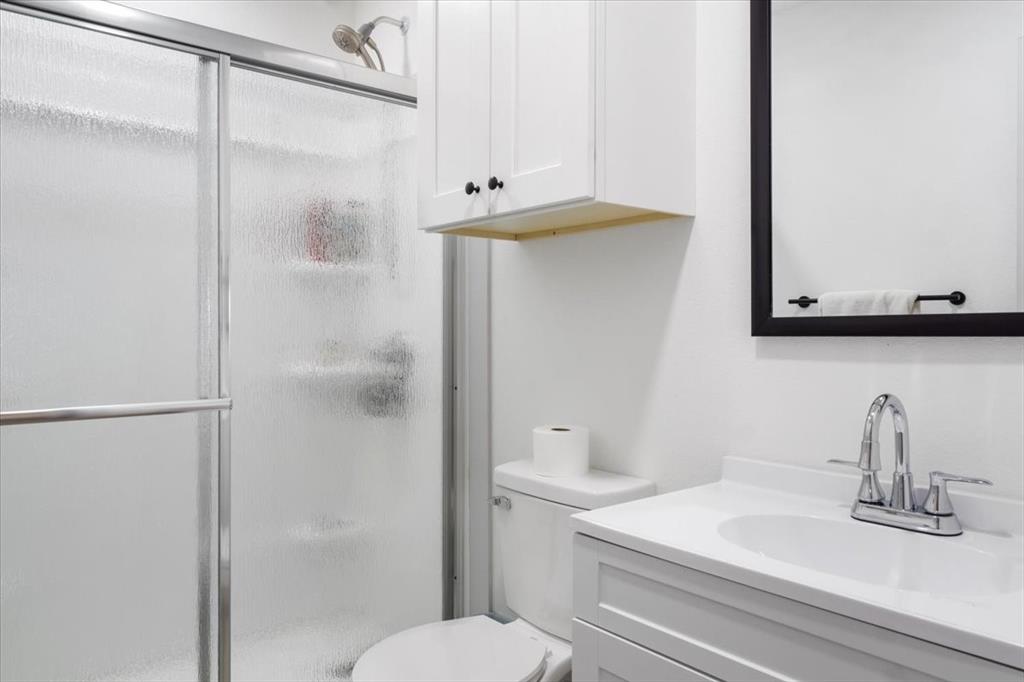 2170 Derrs Chapel Road Italy, TX 76651 - Photo 22 of 38 a bathroom with a sink a toilet and shower