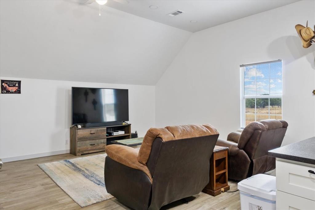 2170 Derrs Chapel Road Italy, TX 76651 - Photo 26 of 38 a living room with furniture and a flat screen tv