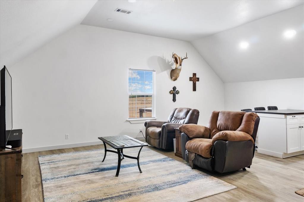2170 Derrs Chapel Road Italy, TX 76651 - Photo 28 of 38 a living room with furniture and a flat screen tv