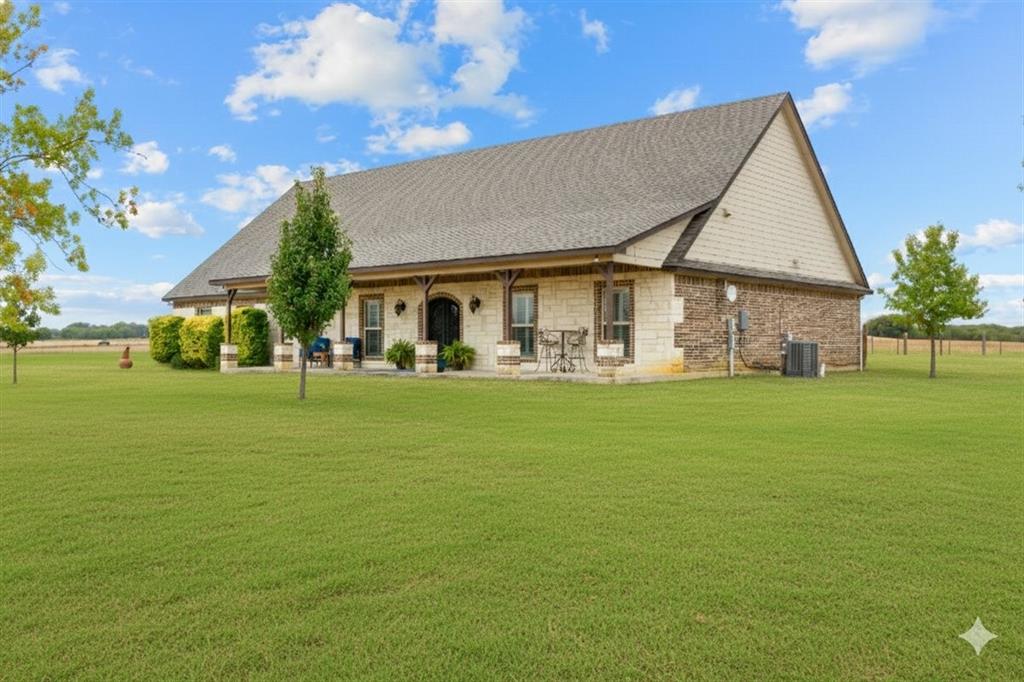 2170 Derrs Chapel Road Italy, TX 76651 - Photo 3 of 38 a front view of house with an outdoor space and seating