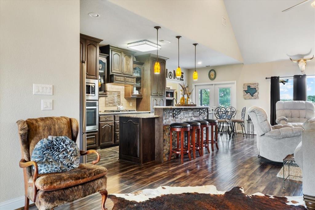 2170 Derrs Chapel Road Italy, TX 76651 - Photo 8 of 38 a living room with furniture kitchen view and a chandelier
