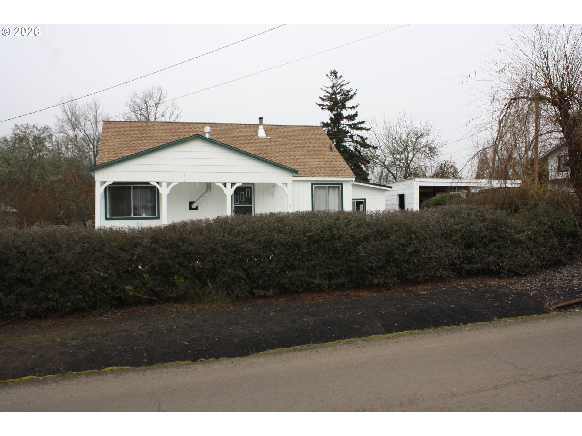 882 Northeast Rifle Range Street Roseburg, OR 97470 - Photo 1 of 16 a front view of a house with a yard