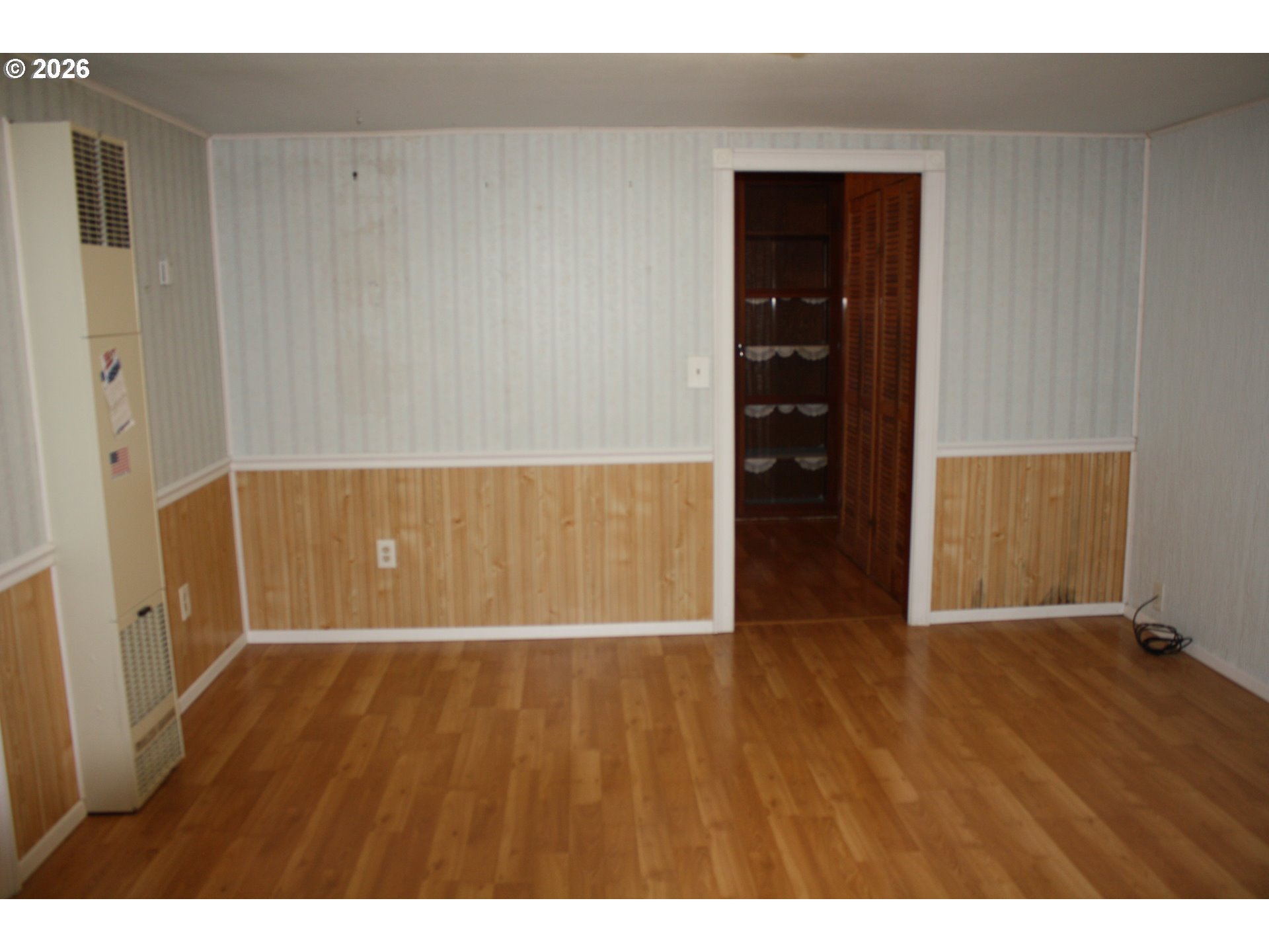 882 Northeast Rifle Range Street Roseburg, OR 97470 - Photo 11 of 16 a view of an empty room with wooden floor