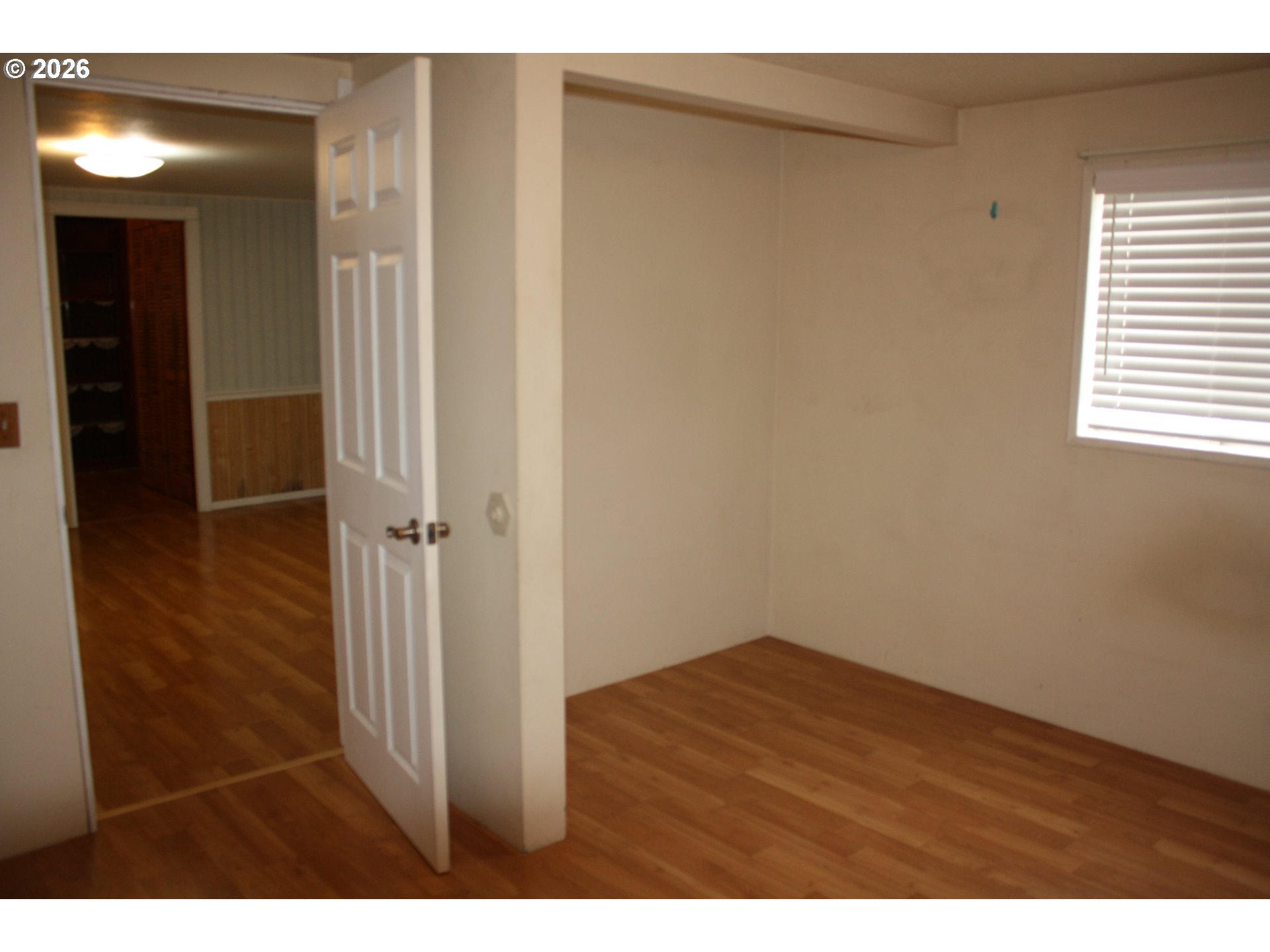 882 Northeast Rifle Range Street Roseburg, OR 97470 - Photo 12 of 16 a view of an empty room with closet and a window