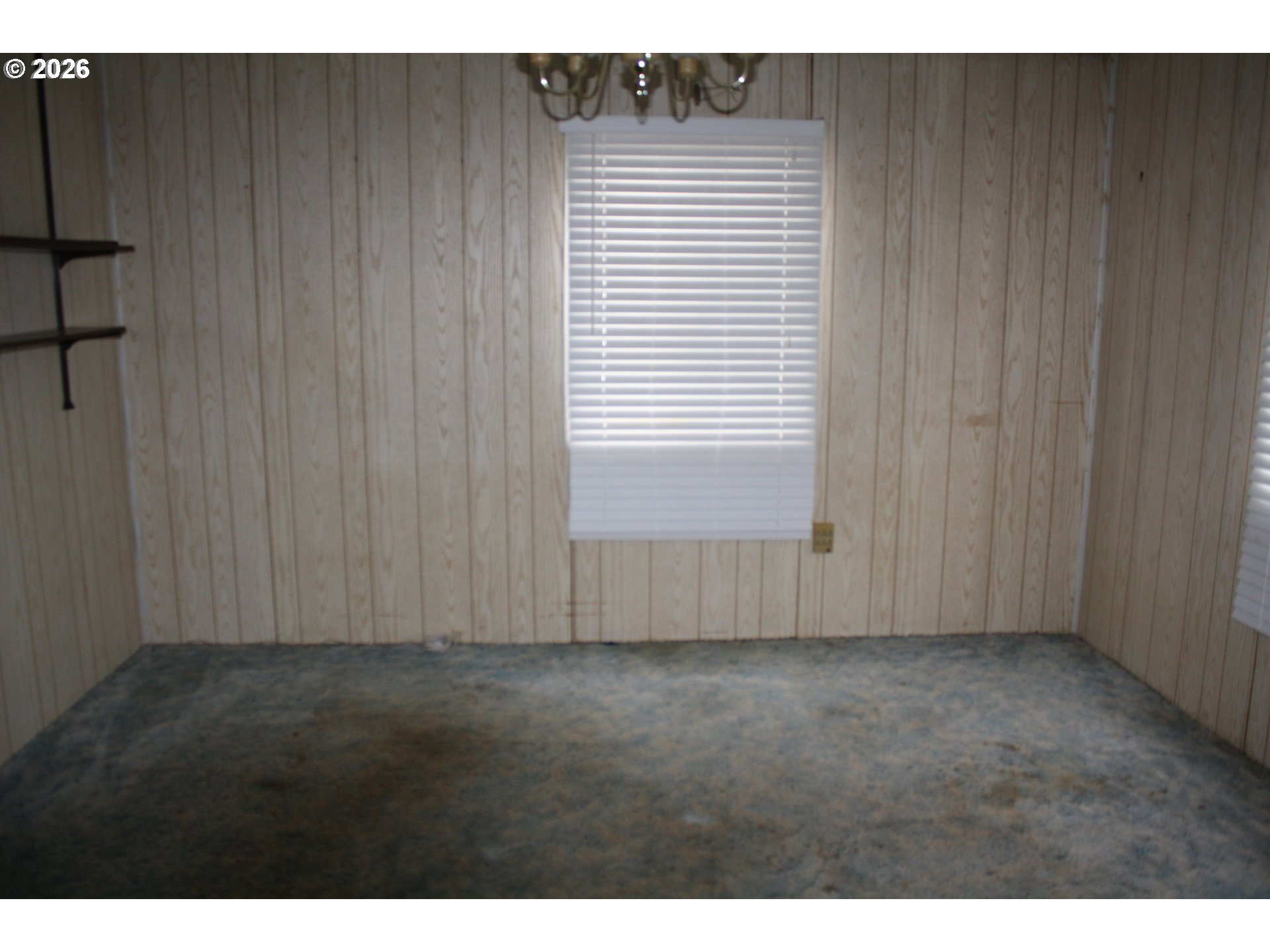 882 Northeast Rifle Range Street Roseburg, OR 97470 - Photo 5 of 16 a view of an empty room with a window