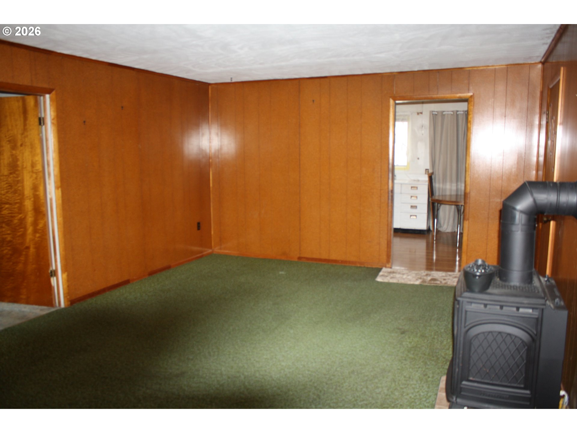 882 Northeast Rifle Range Street Roseburg, OR 97470 - Photo 8 of 16 a view of a livingroom with furniture and an empty room