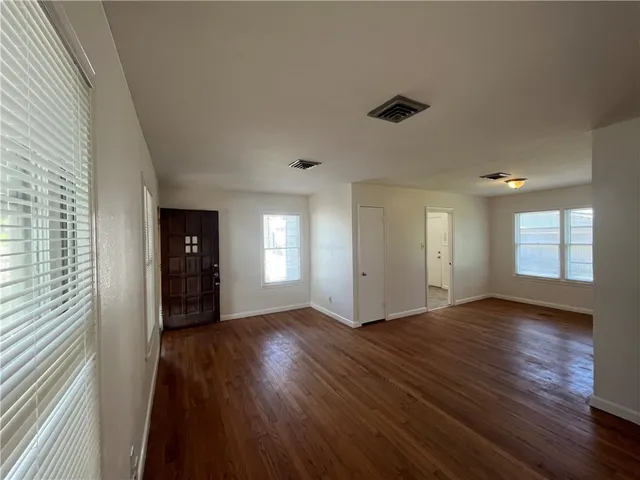a view of an empty room and window