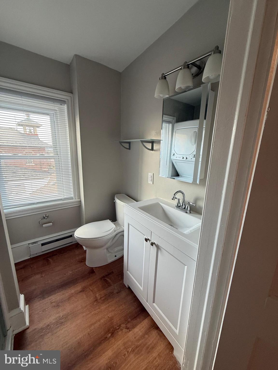 3 West Court Street, Unit 3 Doylestown, PA 18901 - Photo 9 of 12 a bathroom with a sink a toilet and a window