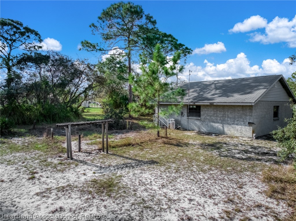 5802 Golden Road Sebring, FL 33875 - Photo 34 of 37 a view of house with a backyard
