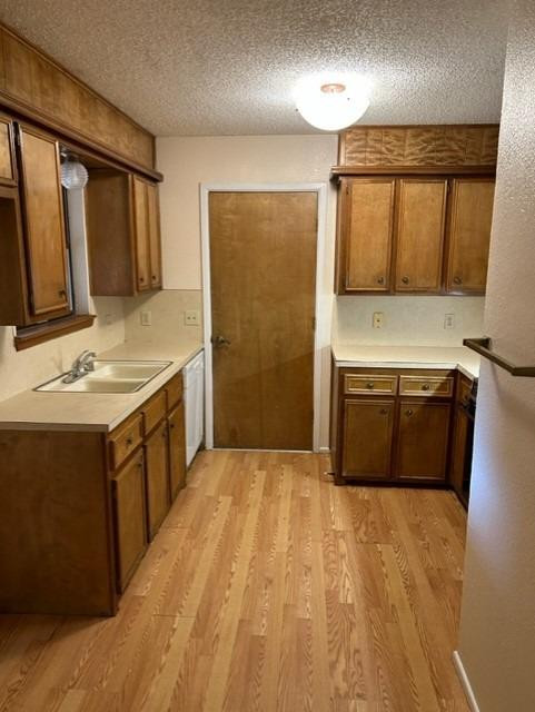 1113 80th Street, Unit B Lubbock, TX 79423 - Photo 4 of 14 a bathroom with a double vanity sink a mirror and a bathtub