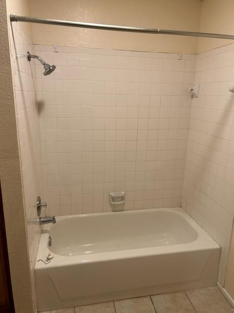 1113 80th Street, Unit B Lubbock, TX 79423 - Photo 8 of 14 a bathroom with a shower and a bath tub