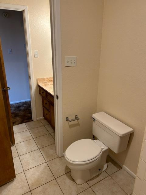 1113 80th Street, Unit B Lubbock, TX 79423 - Photo 9 of 14 a bathroom with a toilet and a sink