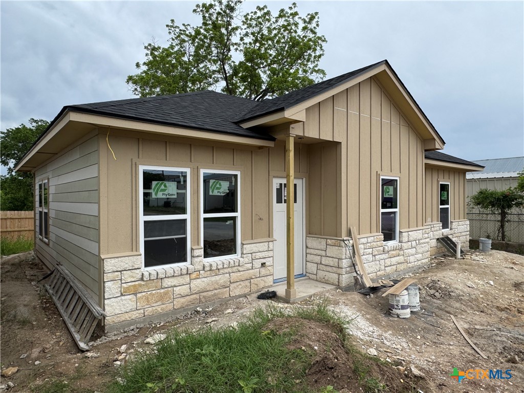 606 Bridge Street Gatesville, TX 76528 - Photo 3 of 14 a front view of a house with a yard outdoor seating and yard