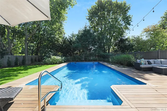 an outdoor space with furniture and umbrella