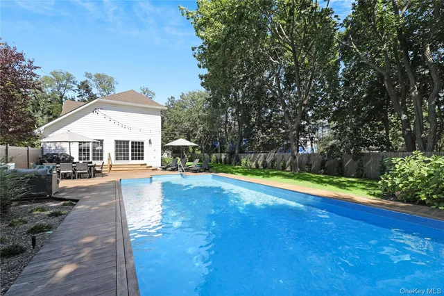a view of a backyard with sitting area