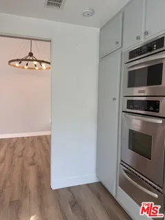 a kitchen with a stove and a microwave