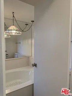 a bathroom with a shower and vanity