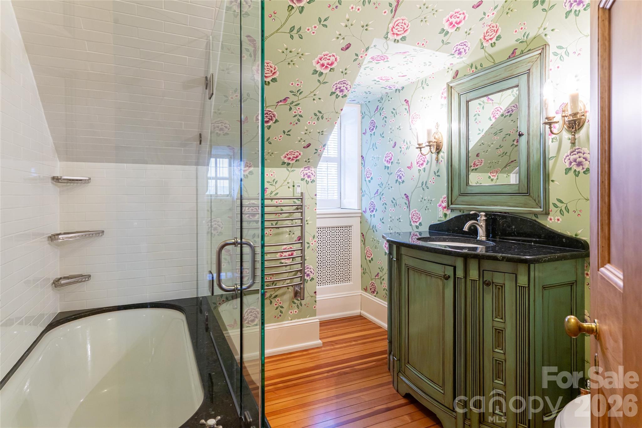 324 Vanderbilt Road Asheville, NC 28803 - Photo 34 of 48 a bathroom with a granite countertop sink a mirror and shower