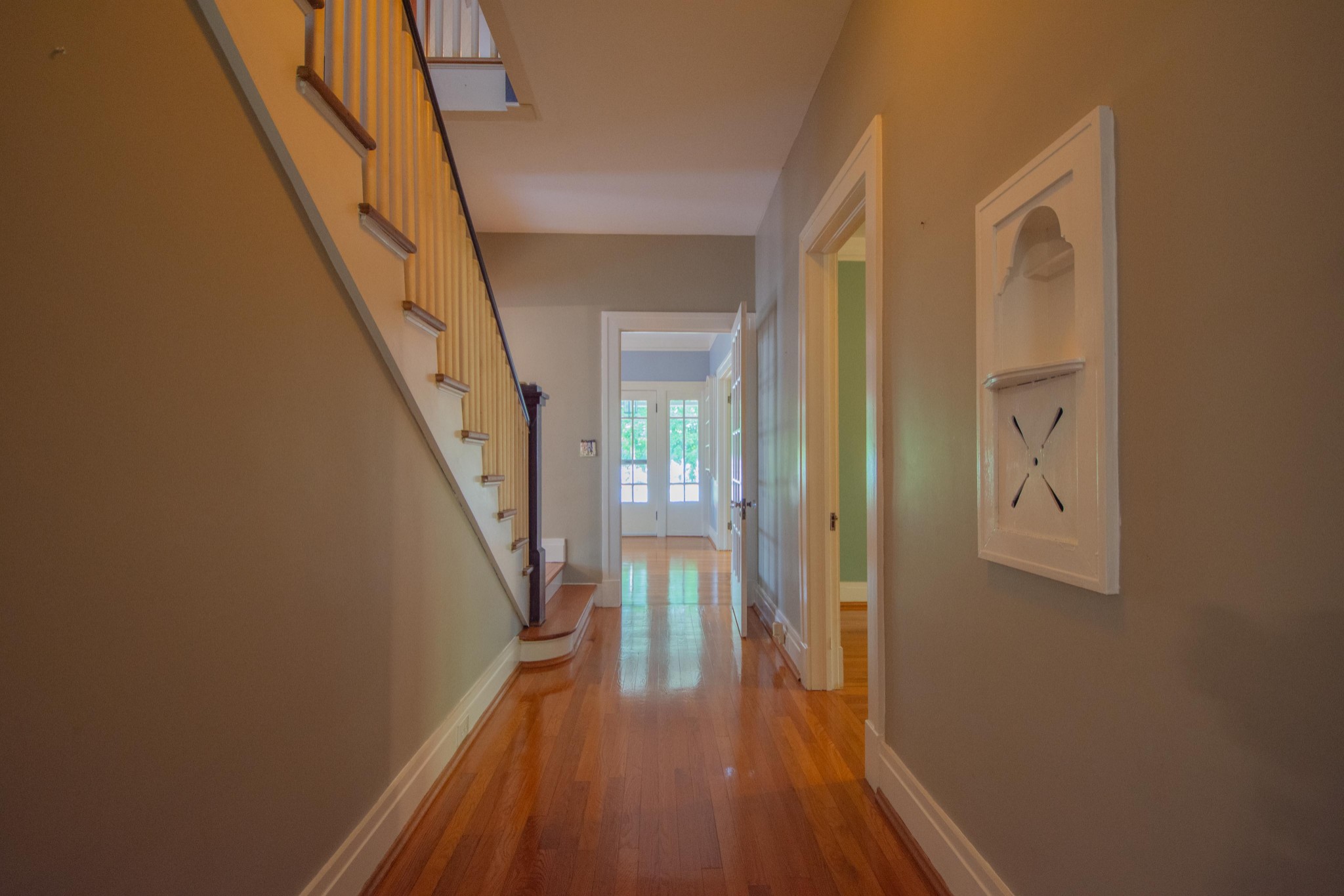 311 South 3rd Street Pulaski, TN 38478 - Photo 20 of 44 a view of a hallway with wooden floor and staircase