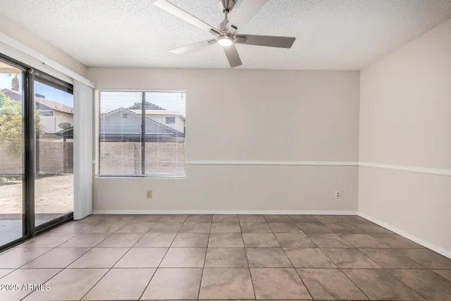a view of a kitchen with a sink and a refrigerator