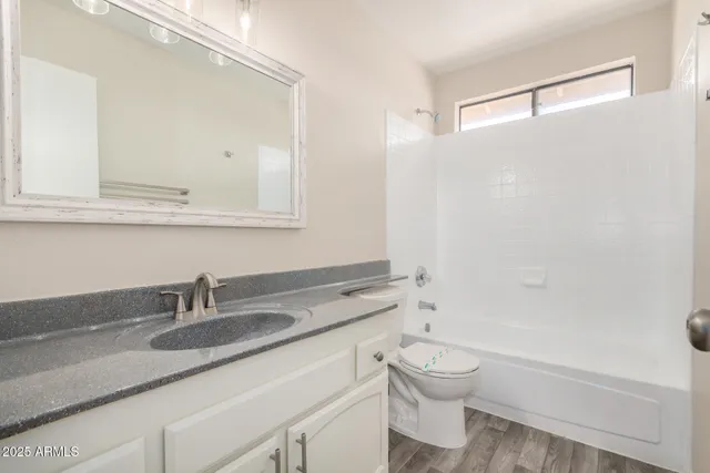 a view of empty room with stairs and mirrors