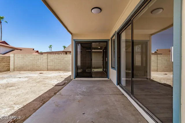 a view of an house with backyard of the house