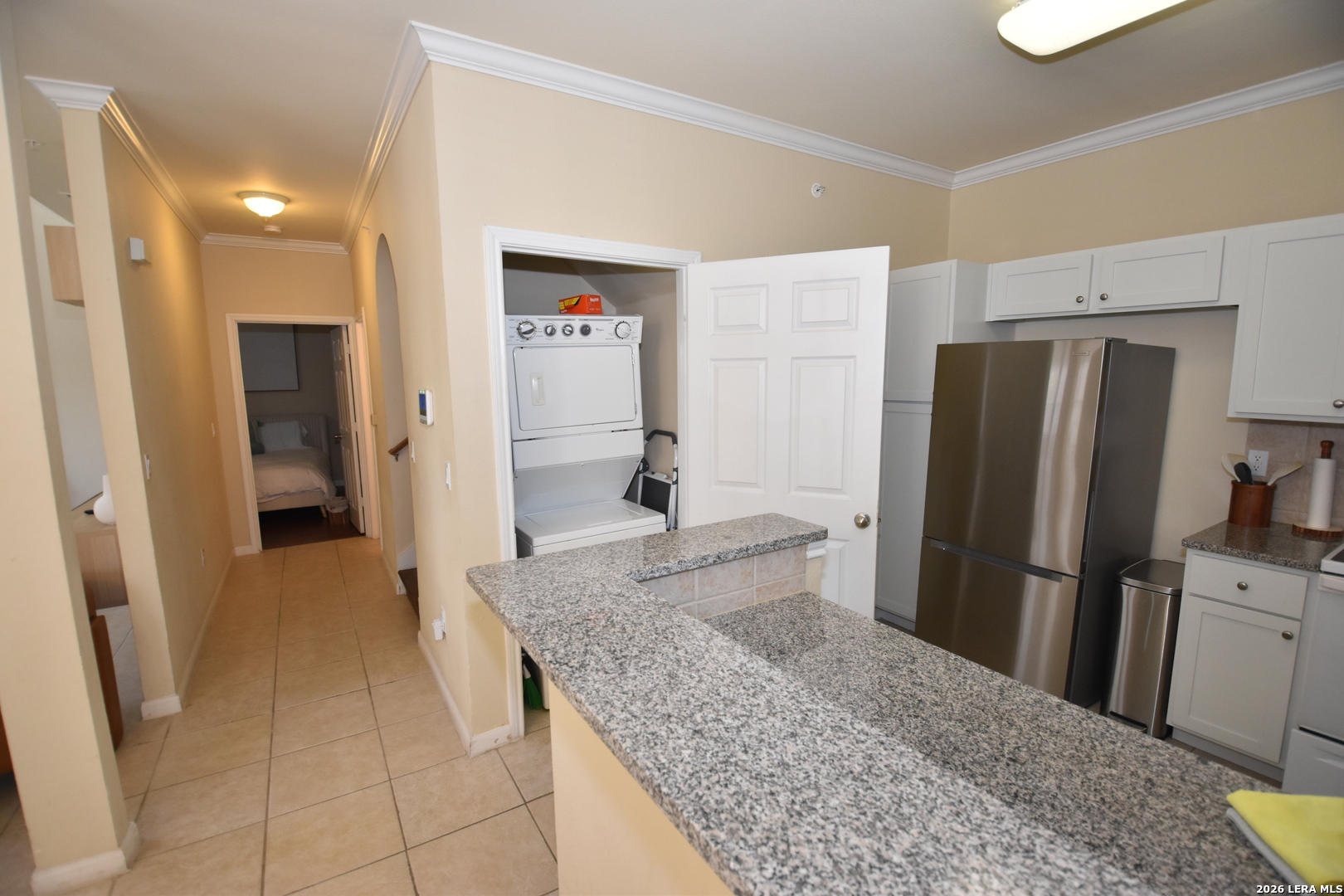 6160 Eckhert Road, Unit 804 San Antonio, TX 78240 - Photo 11 of 39 a kitchen with a refrigerator and a sink