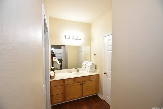 a bathroom with a sink and a mirror