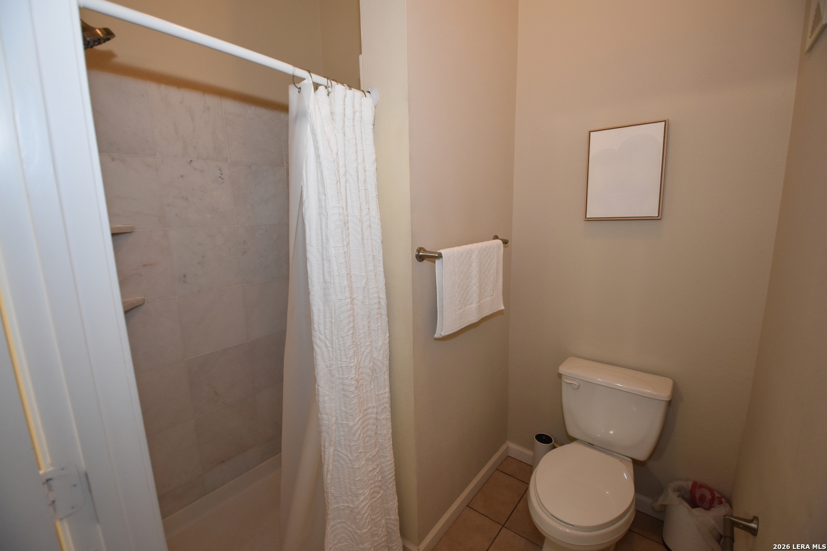 6160 Eckhert Road, Unit 804 San Antonio, TX 78240 - Photo 20 of 39 a white toilet sitting next to a shower