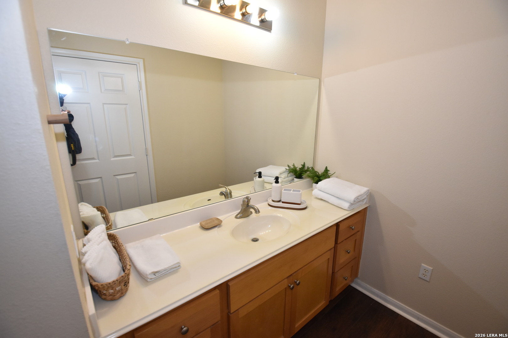 6160 Eckhert Road, Unit 804 San Antonio, TX 78240 - Photo 21 of 39 a bathroom with a sink and a mirror
