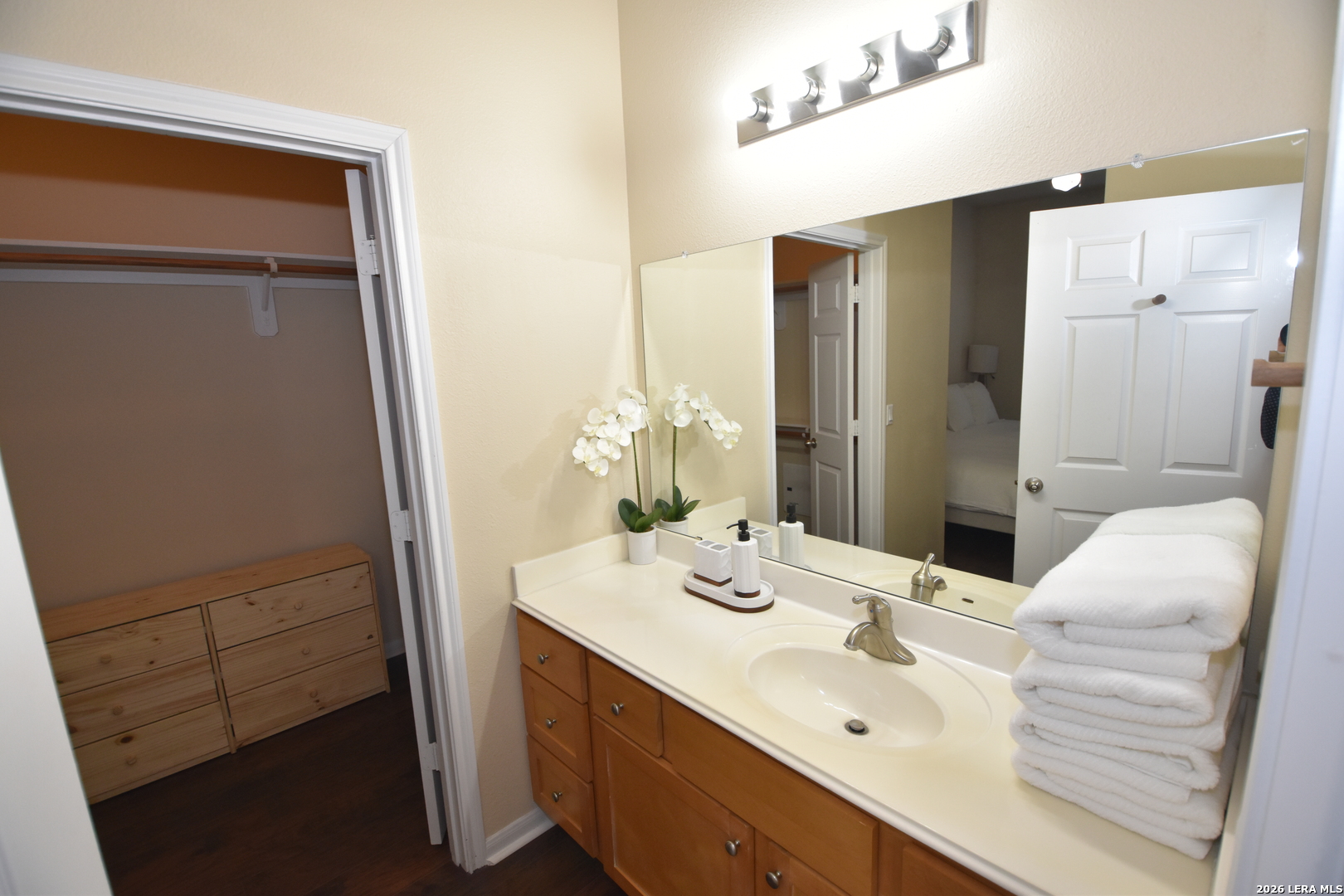 6160 Eckhert Road, Unit 804 San Antonio, TX 78240 - Photo 26 of 39 a bathroom with a sink and a mirror