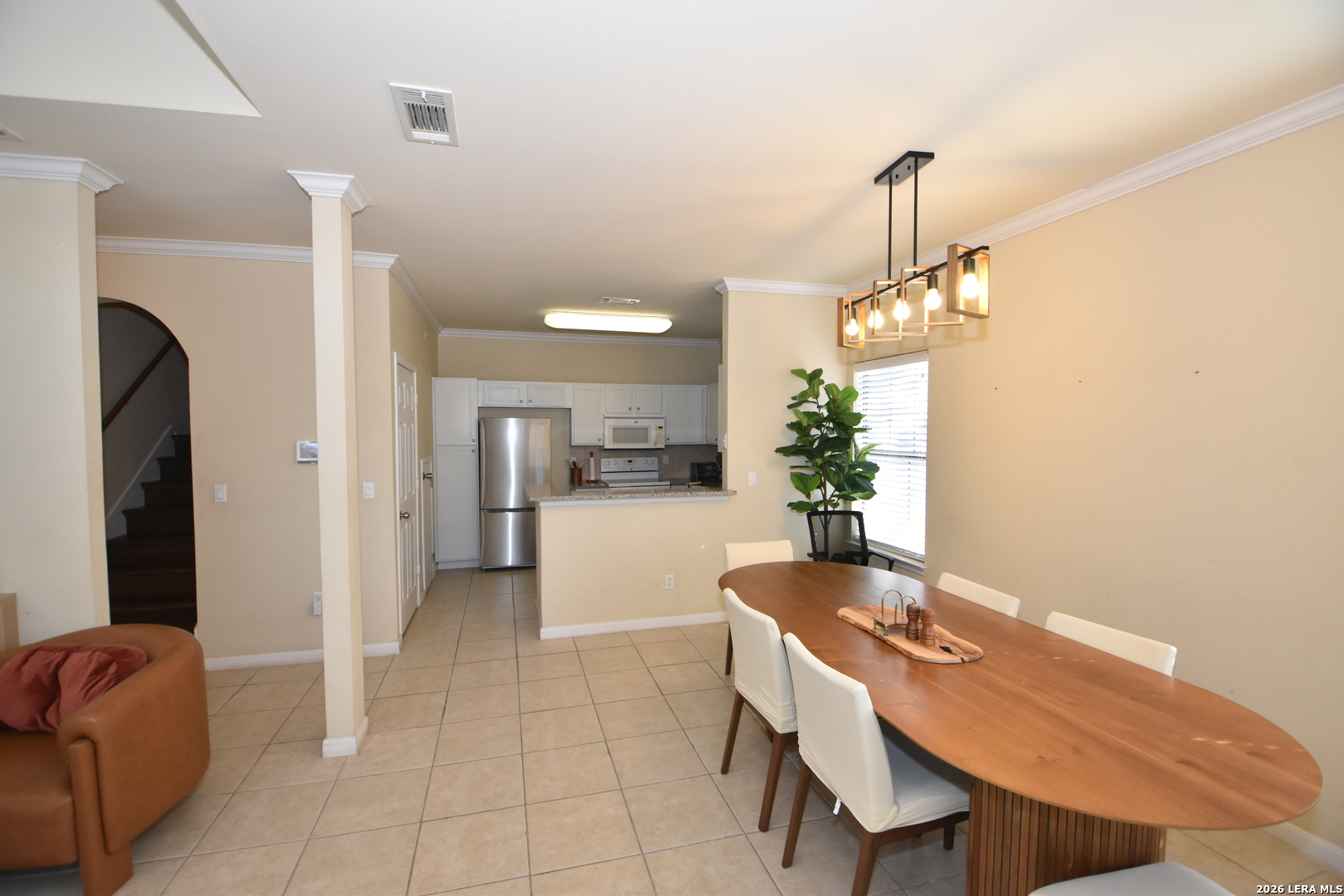 6160 Eckhert Road, Unit 804 San Antonio, TX 78240 - Photo 5 of 39 a dining room with furniture and a chandelier