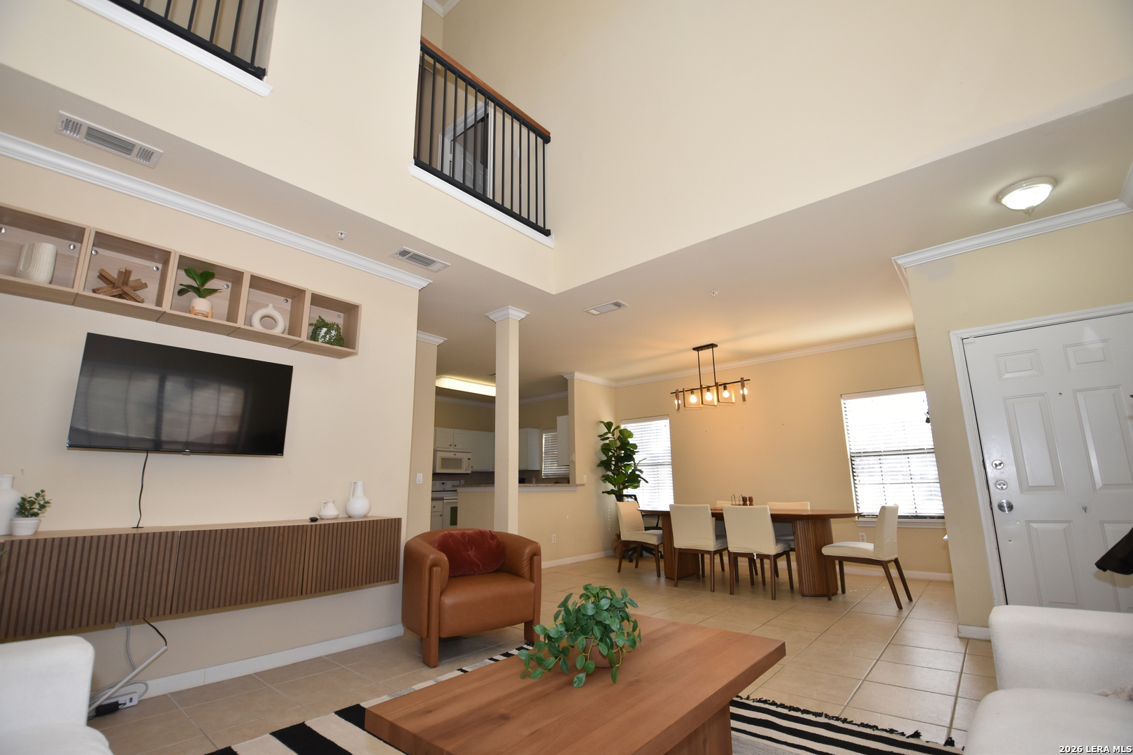 6160 Eckhert Road, Unit 804 San Antonio, TX 78240 - Photo 7 of 39 a living room with furniture and a flat screen tv
