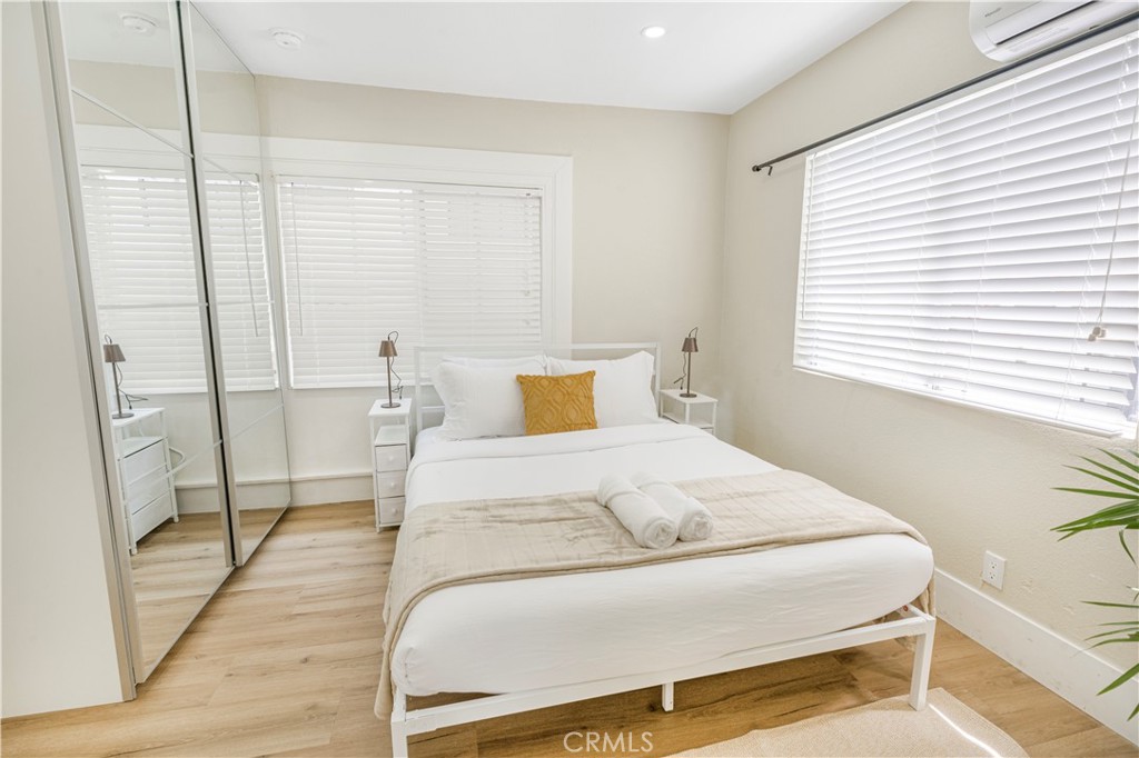 316 La France Avenue, Unit B Alhambra, CA 91801 - Photo 2 of 20 a bedroom with a bed and wooden floor